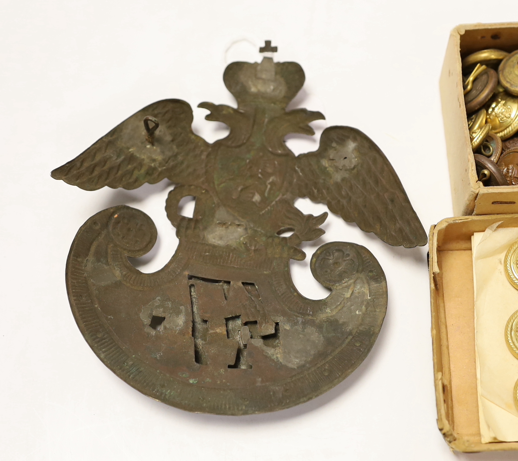 A 19th century Russian style Shako plate and a collection of naval buttons